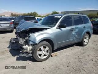2010 Subaru Forester X with VIN JF2SH6BC3AH774677, listed as a Copart auction lot 65765775 with 129,287 mi miles and Salvage title. Bid and sale history available at DreamBid. Image 1.