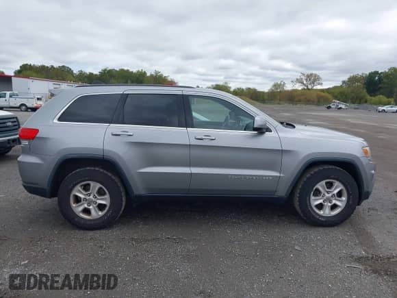 2014 Jeep Grand Cherokee Laredo z VIN 1C4RJFAG0EC251156, wystawiony jako IAAI lot #43428557 z przebiegiem 175 570 mil mil oraz . Historia ofert i sprzedaży dostępna na DreamBid. Obrazek 13.