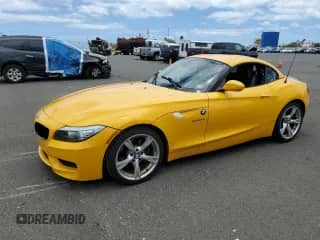 2012 BMW Z4 sDrive28i with VIN WBALL5C57CE716617, listed as a Copart auction lot 61099305 with 76,995 mi miles and Salvage title. Bid and sale history available at DreamBid. Image 1.