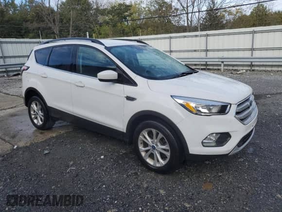 2018 Ford Escape SE z VIN 1FMCU9GDXJUC76982, wystawiony jako Copart lot #87299125 z przebiegiem 88 151 mil mil oraz Czysty tytuł • Clean title. Historia ofert i sprzedaży dostępna na DreamBid. Obrazek 4.