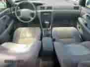 2001 Toyota Camry CE z VIN JT2BG22K910594015, wystawiony jako Copart lot #65016895 z przebiegiem 164 481 mil mil oraz Szkoda całkowita • Salvage title. Historia ofert i sprzedaży dostępna na DreamBid. Obrazek 8.