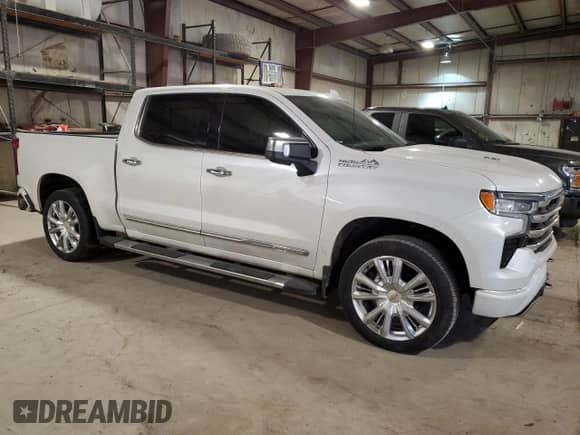 2023 Chevrolet Silverado 1500 High Country with VIN 1GCUDJEL9PZ164268, listed as a Copart auction lot 76899714 with 22,359 mi miles and Salvage title. Bid and sale history available at DreamBid. Image 4.