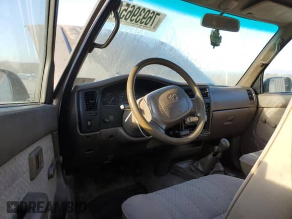 1997 Toyota Tacoma z VIN 4TAWM72N3VZ308584, wystawiony jako Copart lot #76939654 z przebiegiem 259 695 mil mil oraz Szkoda całkowita • Salvage title. Historia ofert i sprzedaży dostępna na DreamBid. Obrazek 8.
