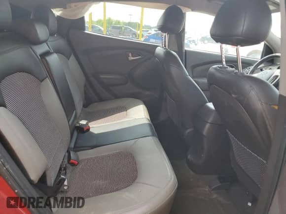 2010 Hyundai Tucson Limited z VIN KM8JU3AC0AU092929, wystawiony jako Copart lot #61043235 z przebiegiem 143 077 mil mil oraz Szkoda całkowita • Salvage title. Historia ofert i sprzedaży dostępna na DreamBid. Obrazek 11.