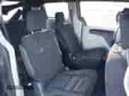 2014 Dodge Grand Caravan American Value with VIN 2C4RDGBG8ER376831, listed as a IAAI auction lot 41379809 with 142,101 mi miles and . Bid and sale history available at DreamBid. Image 8.