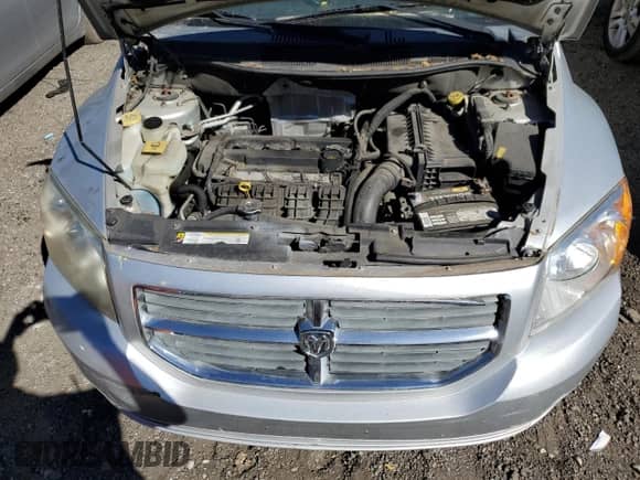 2010 Dodge Caliber Mainstreet with VIN 1B3CB3HA2AD615313, listed as a Copart auction lot 87078025 with 157,176 mi miles and Salvage title. Bid and sale history available at DreamBid. Image 11.