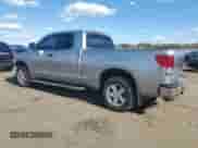 2010 Toyota Tundra z VIN 5TFUY5F1XAX129685, wystawiony jako Copart lot #89627295 z przebiegiem 133 830 mil mil oraz Szkoda całkowita • Salvage title. Historia ofert i sprzedaży dostępna na DreamBid. Obrazek 2.