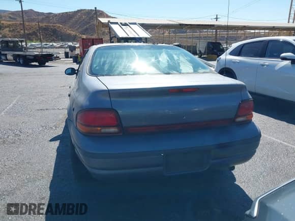 1996 Dodge Stratus z VIN 1B3EJ46X0TN148608, wystawiony jako IAAI lot #40538346 z przebiegiem Nie podano mil oraz . Historia ofert i sprzedaży dostępna na DreamBid. Obrazek 16.