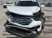 2014 Hyundai Santa Fe с VIN 5XYZUDLB1EG161930, выставлен на аукционе Copart как лот 80828135 с пробегом 80 121 миль миль и Списание • Salvage title. История ставок и продаж доступна на DreamBid. Изображение 14.