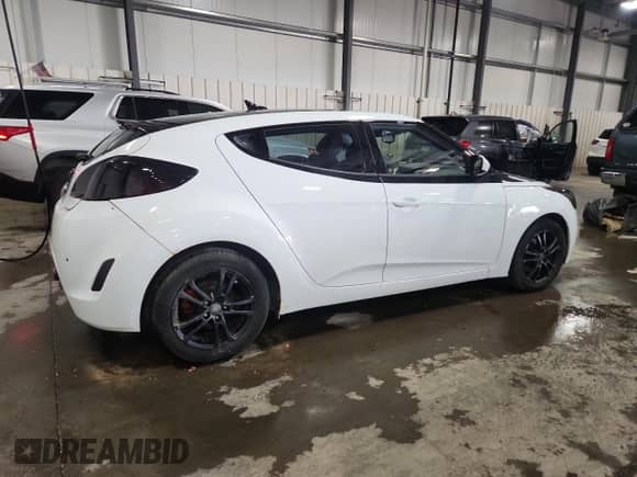 2012 Hyundai Veloster w/Gray Int z VIN KMHTC6AD2CU028769, wystawiony jako Copart lot #70858065 z przebiegiem 165 208 mil mil oraz Szkoda całkowita • Salvage title. Historia ofert i sprzedaży dostępna na DreamBid. Obrazek 3.