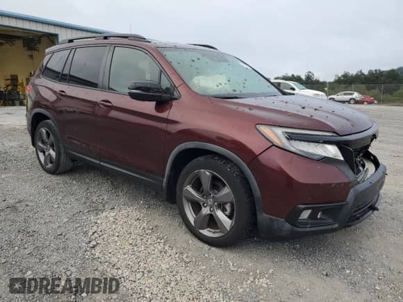 2019 Honda Passport Touring with VIN 5FNYF7H92KB000356, listed as a Copart auction lot 69598615 with 27,658 mi miles and Salvage title. Bid and sale history available at DreamBid. Image 4.