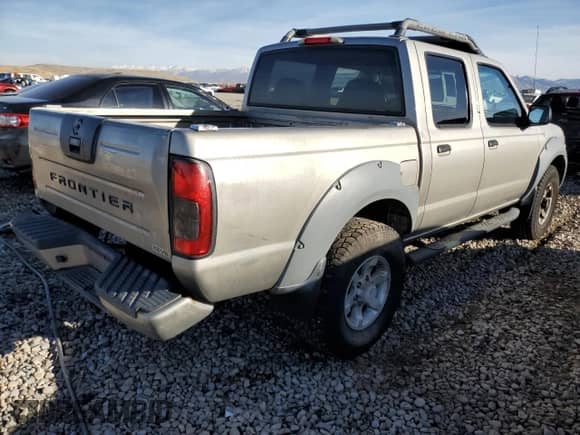 2001 Nissan Frontier SE with VIN 1N6ED27YX1C320098, listed as a Copart auction lot 85301624 with 140,756 mi miles and Salvage title. Bid and sale history available at DreamBid. Image 3.