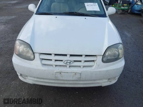2004 Hyundai Accent GL z VIN KMHCG35C74U303431, wystawiony jako IAAI lot #41725717 z przebiegiem 211 893 mil mil oraz . Historia ofert i sprzedaży dostępna na DreamBid. Obrazek 6.