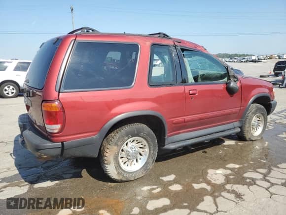 2000 Ford Explorer Sport with VIN 1FMYU60EXYUA76489, listed as a Copart auction lot 66216875 with 133,543 mi miles and Salvage title. Bid and sale history available at DreamBid. Image 3.