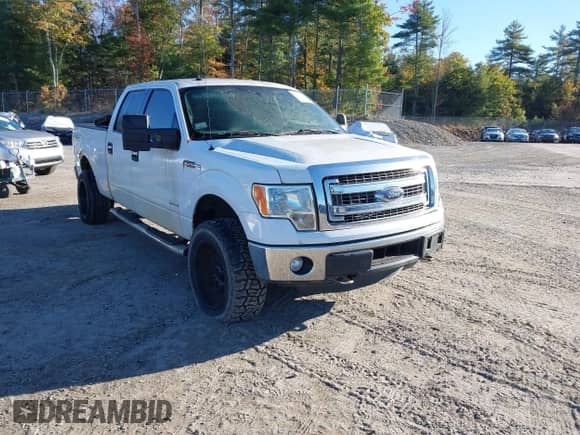 2014 Ford F-150 FX4 with VIN 1FTFW1ET6EFA57504, listed as a IAAI auction lot 43411648 with 213,926 mi miles and . Bid and sale history available at DreamBid. Image 1.