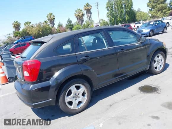2009 Dodge Caliber SXT with VIN 1B3HB48C29D187901, listed as a IAAI auction lot 42727025 with 112,799 mi miles and . Bid and sale history available at DreamBid. Image 4.