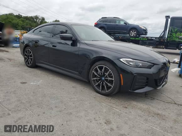 2023 BMW i4 eDrive40 с VIN WBY73AW06PFN95798, выставлен на аукционе Copart как лот 67530055 с пробегом 9 245 миль миль и Списание • Salvage title. История ставок и продаж доступна на DreamBid. Изображение 4.