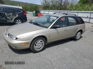 1999 Saturn SW with VIN 1G8ZJ827XXZ323713, listed as a Copart auction lot 55183385 with 166,834 mi miles and Salvage title. Bid and sale history available at DreamBid. Image 1.
