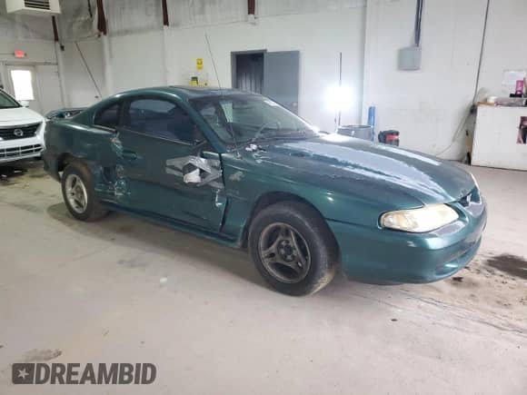 1996 Ford Mustang with VIN 1FALP4047TF229334, listed as a Copart auction lot 49257335 with 184,986 mi miles and Salvage title. Bid and sale history available at DreamBid. Image 4.
