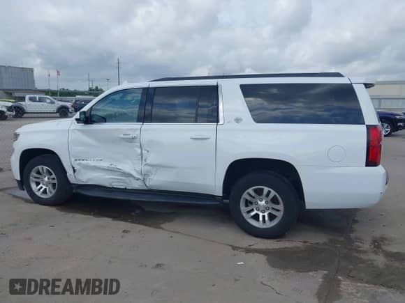 2020 Chevrolet Suburban LT with VIN 1GNSKHKC5LR273483, listed as a IAAI auction lot 42113738 with 122,806 mi miles and . Bid and sale history available at DreamBid. Image 14.