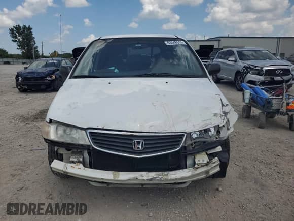 2000 Honda Odyssey LX с VIN 2HKRL1856YH618071, выставлен на аукционе Copart как лот 63548615 с пробегом 206 949 миль миль и Списание • Salvage title. История ставок и продаж доступна на DreamBid. Изображение 5.