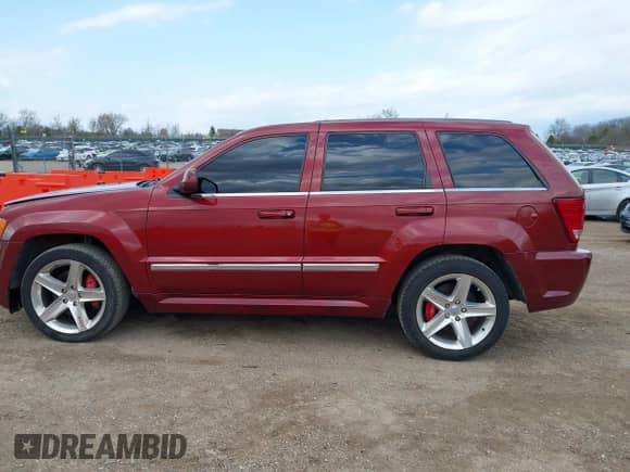2009 Jeep Grand Cherokee with VIN 1J8HR78W69C500470, listed as a IAAI auction lot 42109809 with 87,761 mi miles and . Bid and sale history available at DreamBid. Image 14.