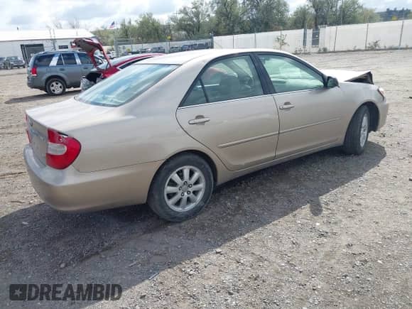 2002 Toyota Camry XLE with VIN JTDBF30K220032817, listed as a IAAI auction lot 43221406 with 108,631 mi miles and . Bid and sale history available at DreamBid. Image 4.