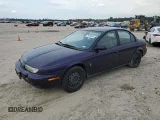 1996 Saturn SL with VIN 1G8ZK5278TZ255742, listed as a Copart auction lot 79050024 with 83,205 mi miles and Salvage title. Bid and sale history available at DreamBid. Image 1.