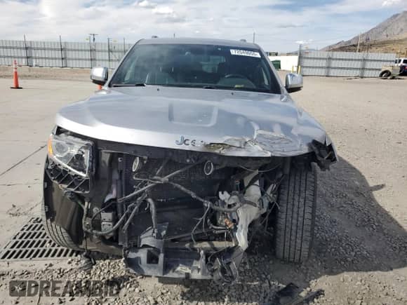 2014 Jeep Grand Cherokee Limited z VIN 1C4RJFBG7EC534037, wystawiony jako Copart lot #72049055 z przebiegiem 103 233 mil mil oraz Szkoda całkowita • Salvage title. Historia ofert i sprzedaży dostępna na DreamBid. Obrazek 5.