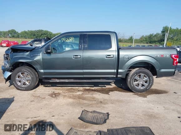 2018 Ford F-150 XLT z VIN 1FTEW1EG4JKC61072, wystawiony jako IAAI lot #42978854 z przebiegiem 126 442 mil mil oraz . Historia ofert i sprzedaży dostępna na DreamBid. Obrazek 14.