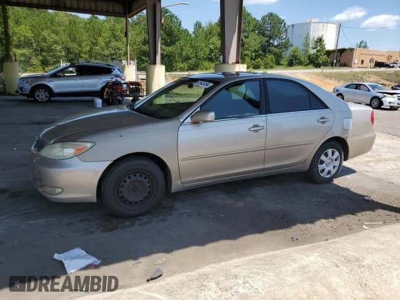 2003 Toyota Camry XLE with VIN 4T1BE32K23U765679, listed as a Copart auction lot 61942494 with Not provided miles and Salvage title. Bid and sale history available at DreamBid. Image 1.