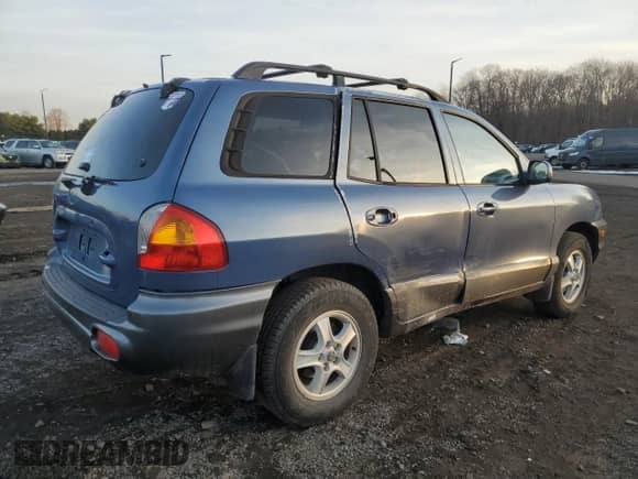2003 Hyundai Santa Fe z VIN KM8SB12B43U392433, wystawiony jako Copart lot #86376144 z przebiegiem 231 989 mil mil oraz Szkoda całkowita • Salvage title. Historia ofert i sprzedaży dostępna na DreamBid. Obrazek 3.