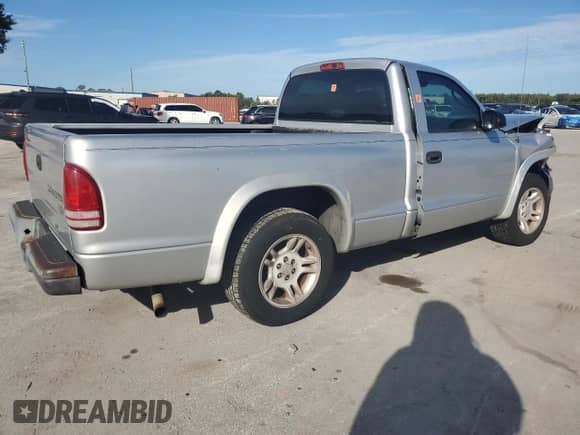 2004 Dodge Dakota z VIN 1D7FL16K44S506611, wystawiony jako Copart lot #82088555 z przebiegiem 264 052 mil mil oraz Szkoda całkowita • Salvage title. Historia ofert i sprzedaży dostępna na DreamBid. Obrazek 3.