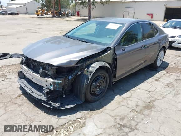 2020 Toyota Camry Hybrid XLE with VIN 4T1F31AK0LU527228, listed as a IAAI auction lot 42532828 with 99,749 mi miles and . Bid and sale history available at DreamBid. Image 21.