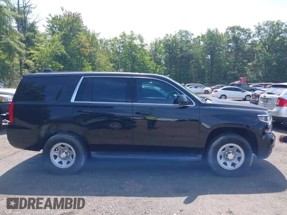 2015 Chevrolet Tahoe Commercial with VIN 1GNSK3EC2FR672807, listed as a IAAI auction lot 42749143 with 91,176 mi miles and . Bid and sale history available at DreamBid. Image 13.