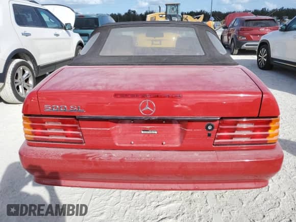 1991 Mercedes-Benz SL с VIN WDBFA66E8MF021631, выставлен на аукционе Copart как лот 77011794 с пробегом Не указан миль и Списание • Salvage title. История ставок и продаж доступна на DreamBid. Изображение 6.