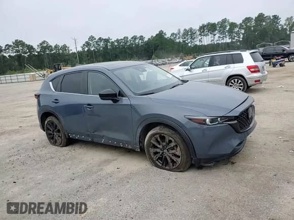 2022 Mazda CX-5 S Carbon Edition z VIN JM3KFBCM2N0612524, wystawiony jako Copart lot #69363155 z przebiegiem 95 306 mil mil oraz Szkoda całkowita • Salvage title. Historia ofert i sprzedaży dostępna na DreamBid. Obrazek 14.