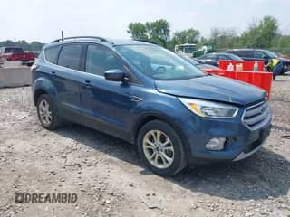 2018 Ford Escape SE z VIN 1FMCU9GD2JUB15834, wystawiony jako IAAI lot #42885507 z przebiegiem 189 098 mil mil oraz . Historia ofert i sprzedaży dostępna na DreamBid. Obrazek 1.