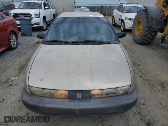 1999 Saturn SL с VIN 1G8ZH5280XZ178863, выставлен на аукционе Copart как лот 73660474 с пробегом 195 738 миль миль и Списание • Salvage title. История ставок и продаж доступна на DreamBid. Изображение 5.