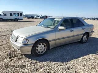 1999 Mercedes-Benz C 230/260/280/320 z VIN WDBHA24GXXA771569, wystawiony jako Copart lot #86552065 z przebiegiem 156 694 mil mil oraz Szkoda całkowita • Salvage title. Historia ofert i sprzedaży dostępna na DreamBid. Obrazek 1.