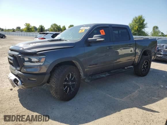 2020 Ram 1500 Rebel z VIN 1C6SRFLT0LN233317, wystawiony jako Copart lot #70363135 z przebiegiem 124 850 mil mil oraz Szkoda całkowita • Salvage title. Historia ofert i sprzedaży dostępna na DreamBid. Obrazek 1.