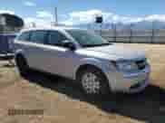 2014 Dodge Journey American Value with VIN 3C4PDCAB3ET140610, listed as a Copart auction lot 86189675 with 124,630 mi miles and Clean title. Bid and sale history available at DreamBid. Image 4.