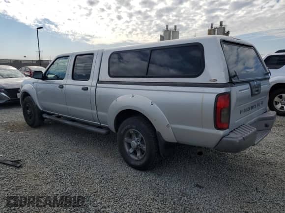 2004 Nissan Frontier XE with VIN 1N6ED29X54C477952, listed as a Copart auction lot 81516345 with 255,069 mi miles and Salvage title. Bid and sale history available at DreamBid. Image 2.