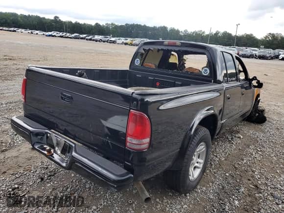 2004 Dodge Dakota Sport с VIN 1D7HL38K14S737127, выставлен на аукционе Copart как лот 58973295 с пробегом Не указан миль и На запчасти • Non repairable. История ставок и продаж доступна на DreamBid. Изображение 3.