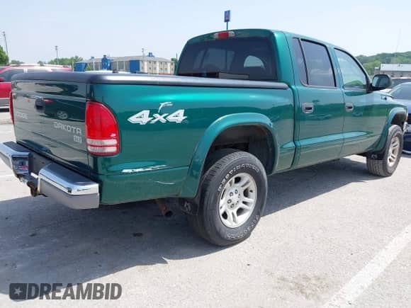 2003 Dodge Dakota SLT with VIN 1D7HG48NX3S278974, listed as a IAAI auction lot 42236636 with 105,211 mi miles and . Bid and sale history available at DreamBid. Image 4.