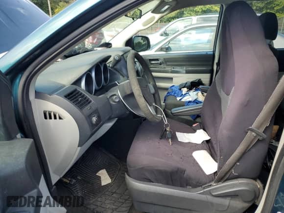 2009 Dodge Grand Caravan SE с VIN 2D8HN44E49R535175, выставлен на аукционе Copart как лот 85103985 с пробегом 163 569 миль миль и Списание • Salvage title. История ставок и продаж доступна на DreamBid. Изображение 7.