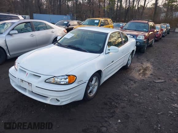 1999 Pontiac Grand Am GT z VIN 1G2NW12E3XM830305, wystawiony jako IAAI lot #41797278 z przebiegiem 87 537 mil mil oraz . Historia ofert i sprzedaży dostępna na DreamBid. Obrazek 2.