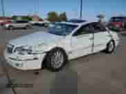 2005 Hyundai XG z VIN KMHFU45E85A380311, wystawiony jako Copart lot #77357584 z przebiegiem Nie podano mil oraz Szkoda całkowita • Salvage title. Historia ofert i sprzedaży dostępna na DreamBid. Obrazek 1.