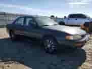 1995 Toyota Camry LE z VIN JT2GK12E3S0117364, wystawiony jako Copart lot #65818255 z przebiegiem 215 464 mil mil oraz Szkoda całkowita • Salvage title. Historia ofert i sprzedaży dostępna na DreamBid. Obrazek 4.