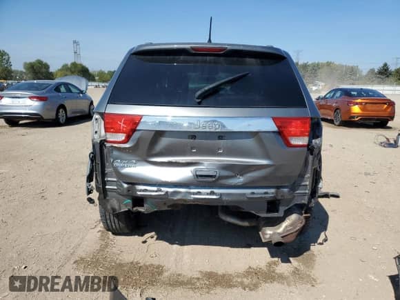 2012 Jeep Grand Cherokee Laredo with VIN 1C4RJFAG2CC135566, listed as a Copart auction lot 80711755 with 163,412 mi miles and Salvage title. Bid and sale history available at DreamBid. Image 6.